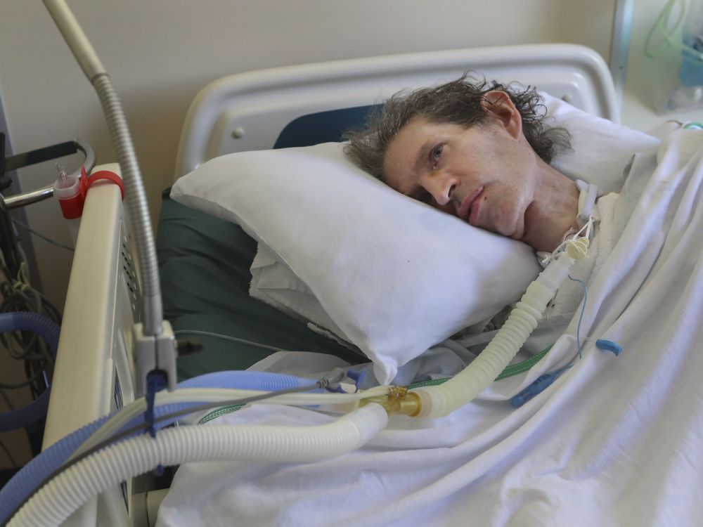 Archie Rolland in his hospital bed, breathing with the help of a ventilator.