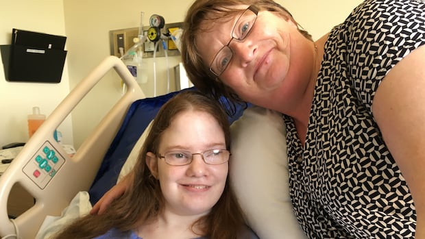 Candice Lewis in hospital with her mother, Sheila Elson.
