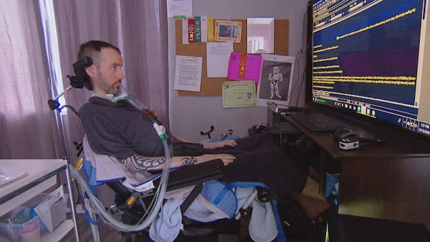 Sean Tagert at home in Vancouver, using the eye-tracking computer that let him communicate.